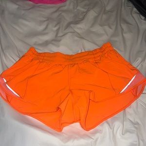 Lululemon hotty hot shorts in highlight orange.